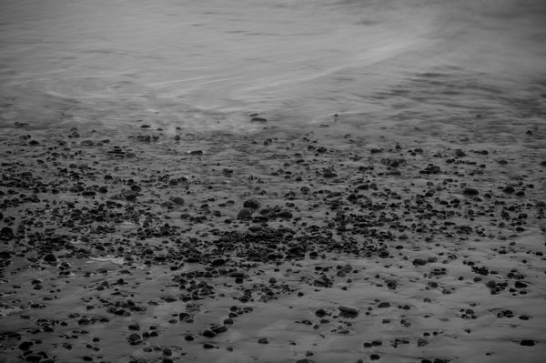 Pebbles and waves at Caswell Bay Pebbles and waves at Caswell Bay