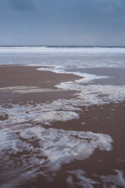 Foam patterns on Caswell Bay, Gower Peninsula Foam patterns on Caswell Bay, Gower Peninsula